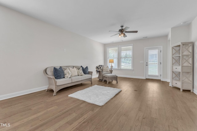 1003 Branwell Dr, Durham, NC 27703 - living area with ceiling fan and light wood-type flooring