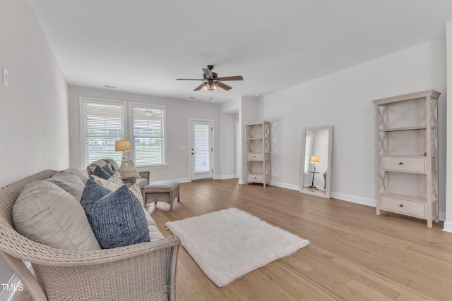 1003 Branwell Dr, Durham, NC 27703 - living room with light wood finished floors and ceiling fan