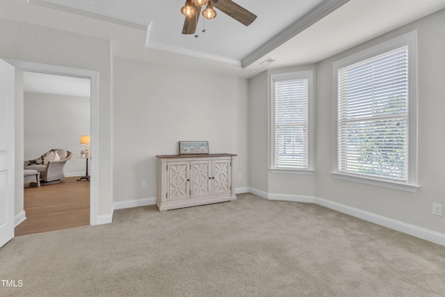 1003 Branwell Dr, Durham, NC 27703 - carpeted empty room featuring a ceiling fan, crown molding, and a raised ceiling