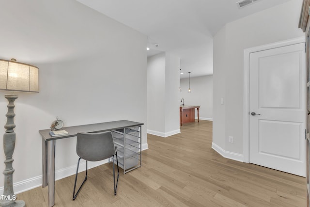 1003 Branwell Dr, Durham, NC 27703 - office area with light wood-style flooring and recessed lighting