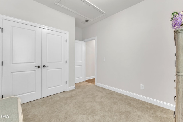 1003 Branwell Dr, Durham, NC 27703 - unfurnished bedroom with attic access, light carpet, and a closet