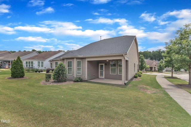 1003 Branwell Dr, Durham, NC 27703 - view of front of property with a front yard and a patio area