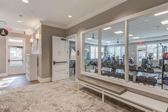 1003 Branwell Dr, Durham, NC 27703 - hallway featuring ornamental molding, wood finished floors, and recessed lighting