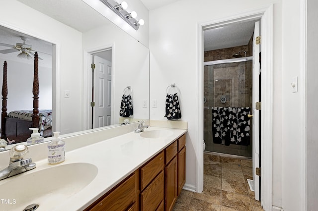 405 E Maple Ave, Holly Springs, NC 27540 - bathroom featuring a stall shower, ensuite bath, double vanity, and ceiling fan