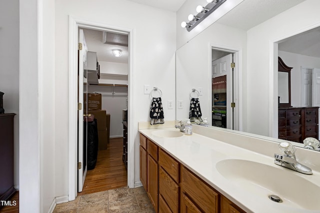 405 E Maple Ave, Holly Springs, NC 27540 - full bathroom featuring double vanity and stone finish floors
