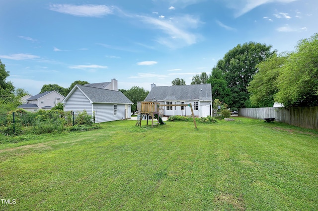 405 E Maple Ave, Holly Springs, NC 27540 - rear view of property featuring a playground and a chimney