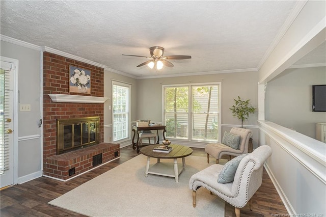 3516 Worley St, Fayetteville, NC 28311 - living area featuring wood finished floors, ceiling fan, a fireplace, and crown molding