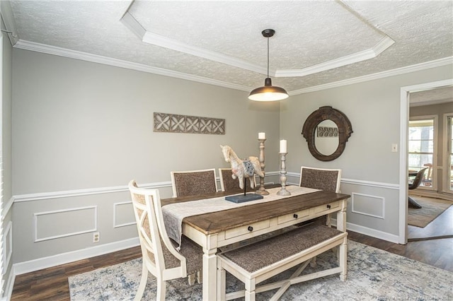 3516 Worley St, Fayetteville, NC 28311 - dining room with a textured ceiling, wood finished floors, a raised ceiling, ornamental molding, and wainscoting