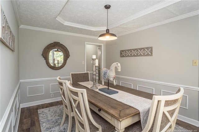 3516 Worley St, Fayetteville, NC 28311 - dining room with wood finished floors, a textured ceiling, a wainscoted wall, a decorative wall, and crown molding