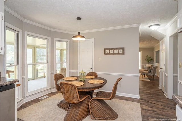 3516 Worley St, Fayetteville, NC 28311 - dining space with dark wood-style flooring, ornamental molding, and a textured ceiling