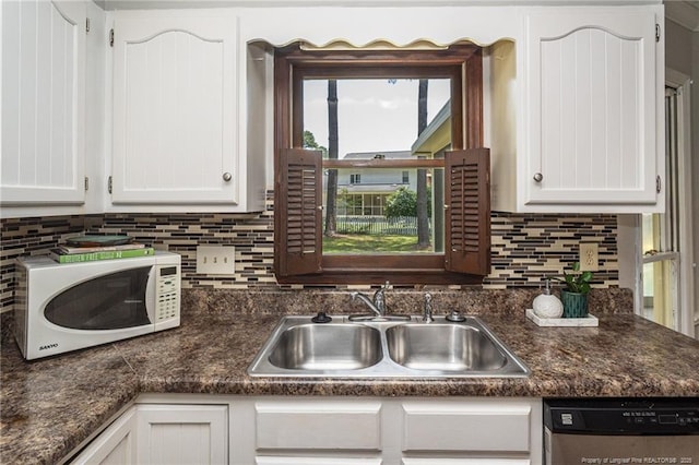 3516 Worley St, Fayetteville, NC 28311 - kitchen featuring white microwave, stainless steel dishwasher, white cabinets, and dark countertops