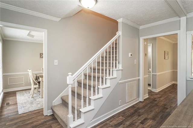 3516 Worley St, Fayetteville, NC 28311 - stairway with wood finished floors, a textured ceiling, and ornamental molding