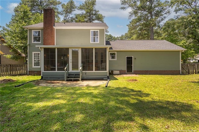 3516 Worley St, Fayetteville, NC 28311 - rear view of house with a sunroom and a chimney