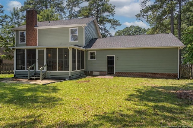 3516 Worley St, Fayetteville, NC 28311 - back of house featuring a sunroom, a chimney, and entry steps