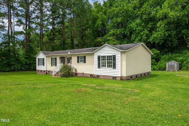 5568 N NC Highway 58, Nashville, NC 27856 - manufactured / mobile home featuring crawl space, a storage unit, and a front yard
