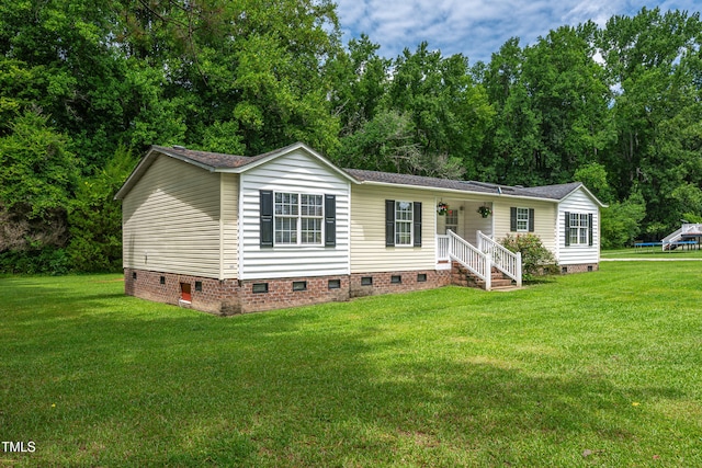 5568 N NC Highway 58, Nashville, NC 27856 - manufactured / mobile home featuring crawl space, a front yard, and roof with shingles