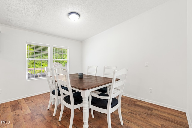 5568 N NC Highway 58, Nashville, NC 27856 - dining room featuring wood finished floors, a textured ceiling, and ornamental molding