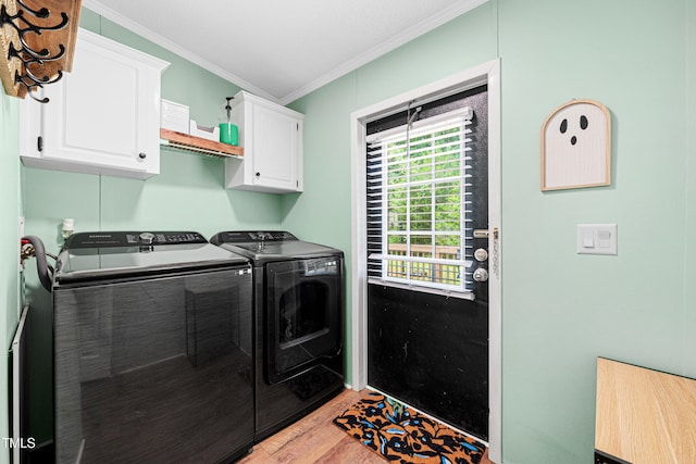 5568 N NC Highway 58, Nashville, NC 27856 - laundry area with cabinet space, washing machine and clothes dryer, crown molding, and light wood finished floors