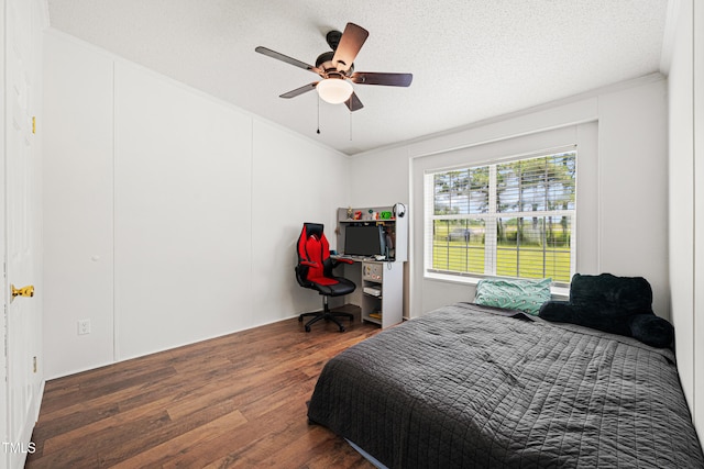 5568 N NC Highway 58, Nashville, NC 27856 - bedroom featuring wood finished floors, ornamental molding, ceiling fan, and a textured ceiling