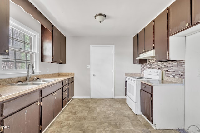 1220 Blarney Ct, Raleigh, NC 27610 - kitchen featuring white electric range oven, under cabinet range hood, backsplash, and light countertops