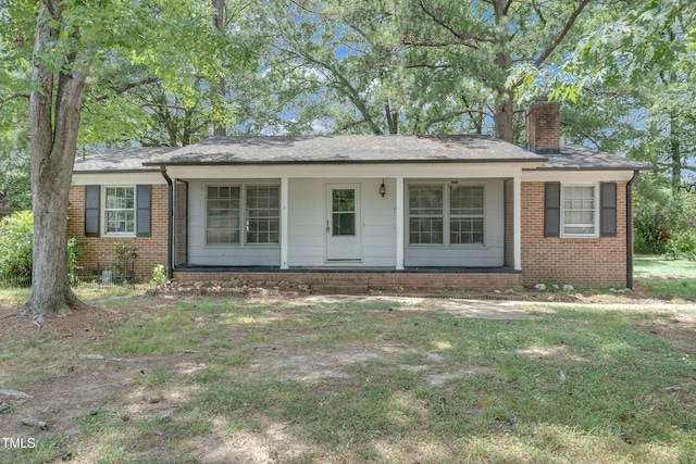 1220 Blarney Ct, Raleigh, NC 27610 - single story home featuring a chimney, brick siding, and covered porch