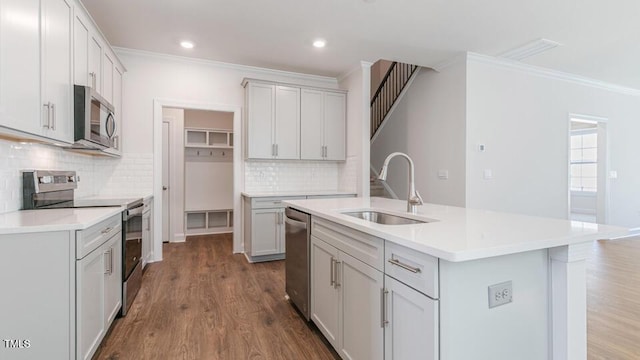 2304 Sugar Cone Way, Fuquay Varina, NC 27526 - kitchen featuring stainless steel appliances, ornamental molding, backsplash, dark wood-type flooring, and light countertops
