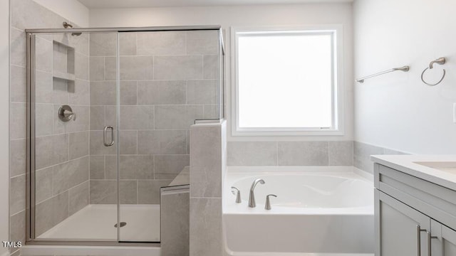 2304 Sugar Cone Way, Fuquay Varina, NC 27526 - full bath featuring vanity, a stall shower, and a garden tub