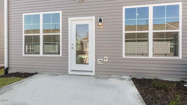 2304 Sugar Cone Way, Fuquay Varina, NC 27526 - doorway to property with a patio