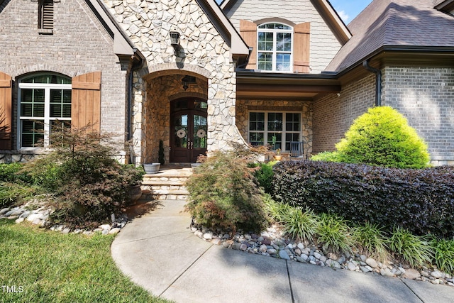 2101 Blue Haven Ct, Wake Forest, NC 27587 - property entrance with french doors, stone siding, and brick siding