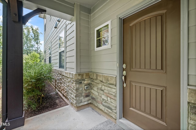 677 Wickham Ridge Rd, Apex, NC 27539 - view of exterior entry featuring stone siding