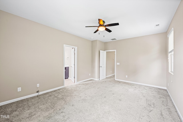 677 Wickham Ridge Rd, Apex, NC 27539 - unfurnished bedroom featuring light colored carpet, ensuite bath, and ceiling fan