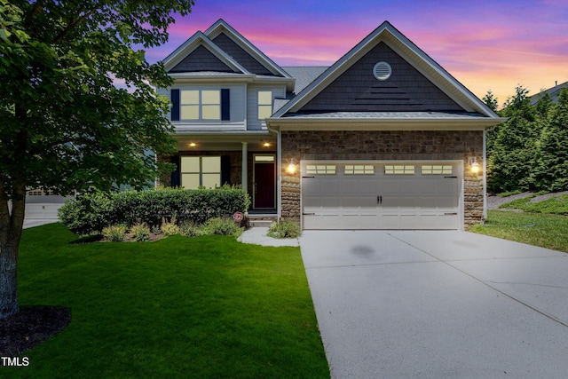 4 Seawell Ct, Durham, NC 27703 - craftsman house with a front yard, concrete driveway, a garage, and stone siding
