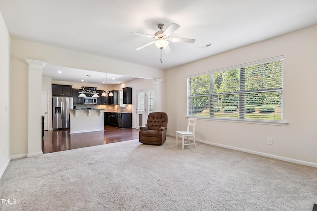 4 Seawell Ct, Durham, NC 27703 - living area with dark carpet, decorative columns, ceiling fan, and recessed lighting