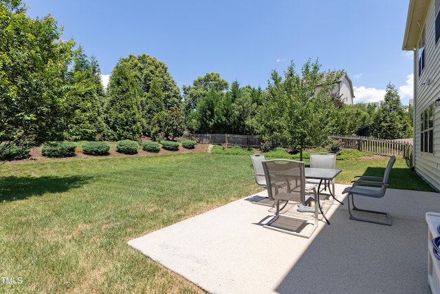4 Seawell Ct, Durham, NC 27703 - fenced backyard featuring a patio area and outdoor dining space