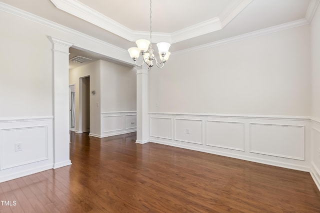 4 Seawell Ct, Durham, NC 27703 - empty room with decorative columns, a chandelier, wood finished floors, ornamental molding, and a decorative wall