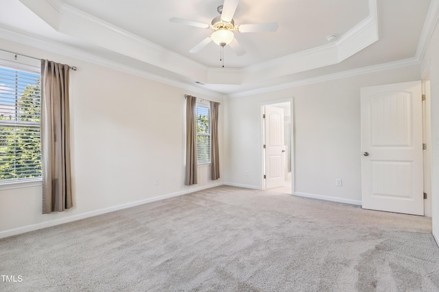 4 Seawell Ct, Durham, NC 27703 - unfurnished room with a tray ceiling, plenty of natural light, ornamental molding, ceiling fan, and carpet