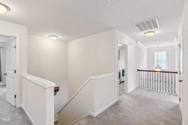 4 Seawell Ct, Durham, NC 27703 - corridor featuring an upstairs landing, carpet flooring, and independent washer and dryer