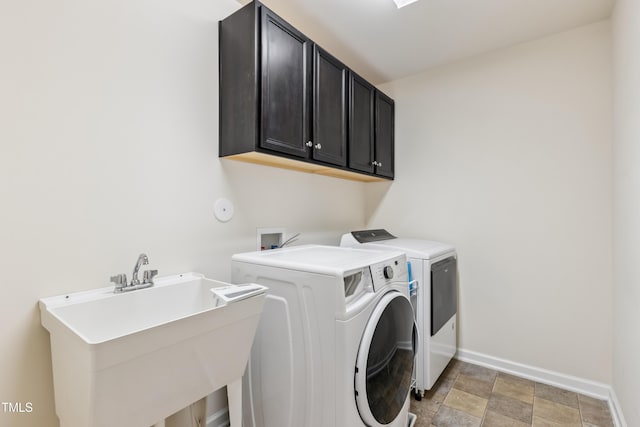 4 Seawell Ct, Durham, NC 27703 - laundry room with cabinet space, independent washer and dryer, and light stone finish floors
