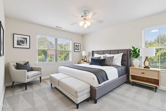 4 Seawell Ct, Durham, NC 27703 - bedroom with multiple windows, light carpet, and ceiling fan