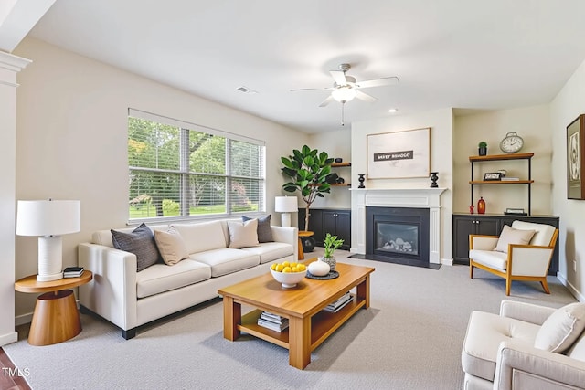 4 Seawell Ct, Durham, NC 27703 - living room with a ceiling fan, a fireplace with flush hearth, and carpet floors