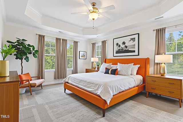 4 Seawell Ct, Durham, NC 27703 - bedroom with a raised ceiling, multiple windows, crown molding, light colored carpet, and ceiling fan