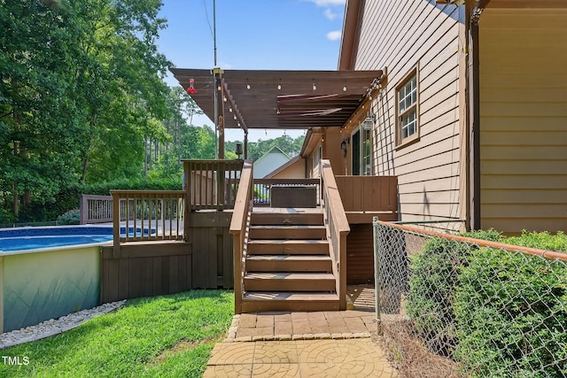 116 Seminole Dr, Louisburg, NC 27549 - deck featuring an outdoor pool and stairs