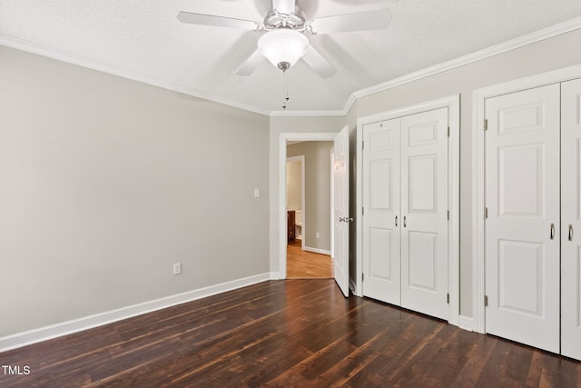 116 Seminole Dr, Louisburg, NC 27549 - unfurnished bedroom with dark wood-style flooring, crown molding, a ceiling fan, and a textured ceiling