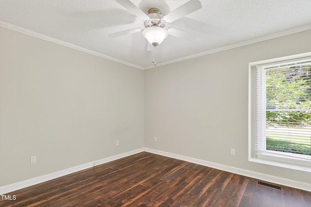 116 Seminole Dr, Louisburg, NC 27549 - spare room featuring dark wood-style floors, ornamental molding, and a ceiling fan