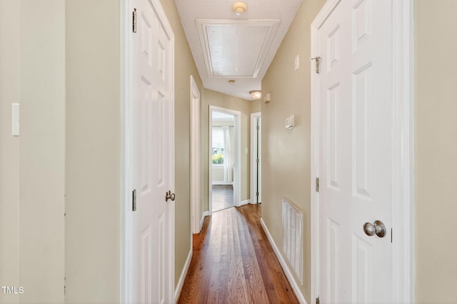 116 Seminole Dr, Louisburg, NC 27549 - hallway with attic access and wood finished floors