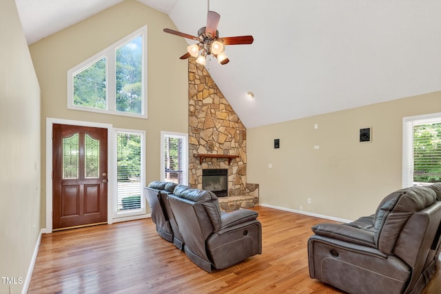116 Seminole Dr, Louisburg, NC 27549 - living area with a ceiling fan, a fireplace, light wood-style floors, and high vaulted ceiling