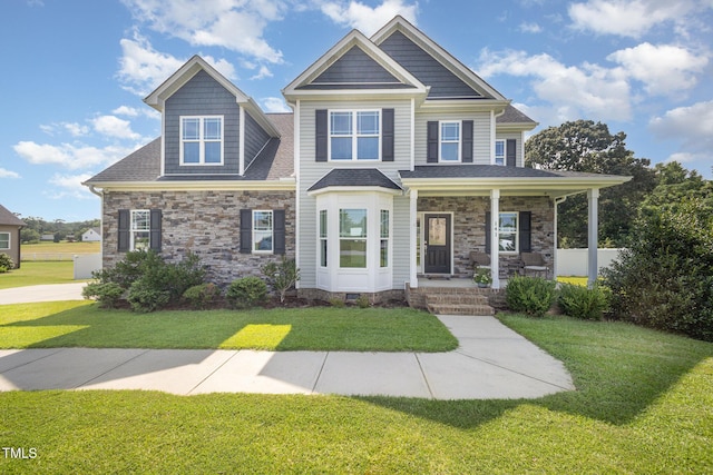 141 Vibernum Vw, Four Oaks, NC 27524 - craftsman inspired home with covered porch, a front lawn, and stone siding