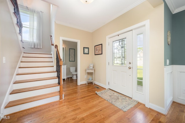 141 Vibernum Vw, Four Oaks, NC 27524 - entryway with crown molding, light wood finished floors, and stairway