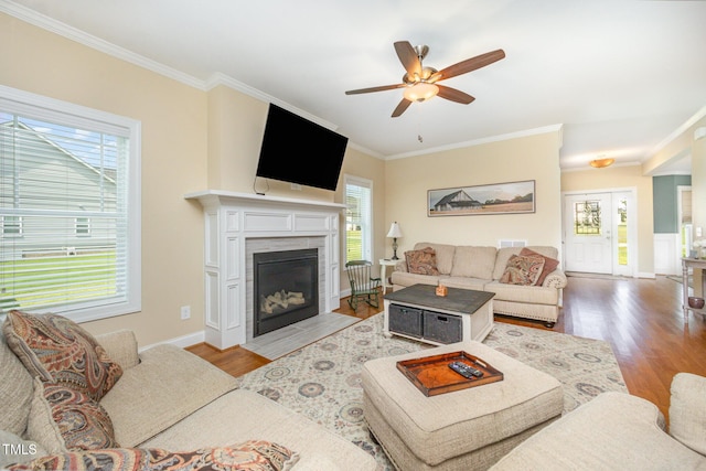 141 Vibernum Vw, Four Oaks, NC 27524 - living room with crown molding, wood finished floors, a ceiling fan, and a fireplace with flush hearth