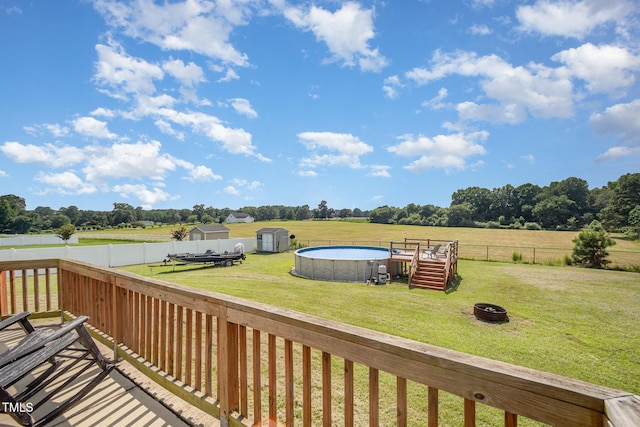 141 Vibernum Vw, Four Oaks, NC 27524 - wooden terrace featuring a view of countryside, an outdoor fire pit, and a fenced backyard